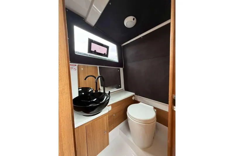 Virtue Yacht Photos Pics Modern bathroom in 2026 Virtue V10 with sleek black sink and compact toilet.