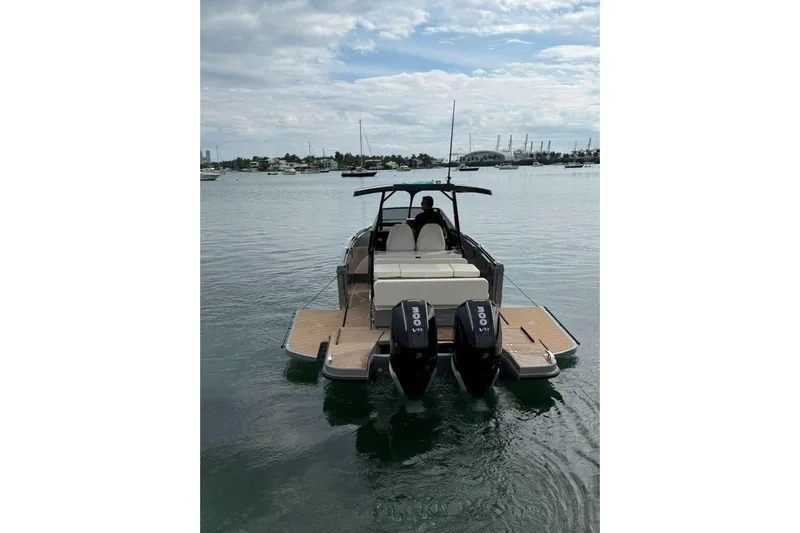 Virtue Yacht Photos Pics 2026 Virtue V10 boat with dual 300 HP engines on calm water.