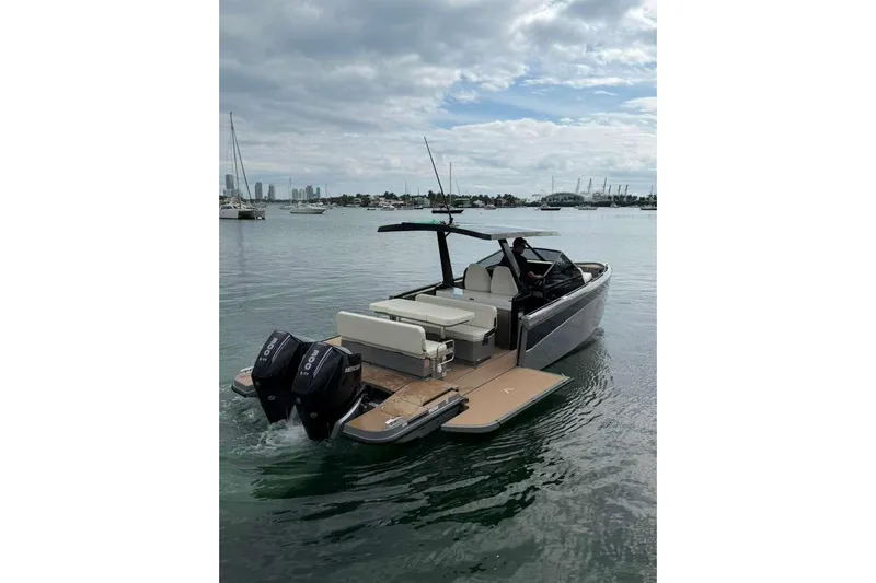 Virtue Yacht Photos Pics 2026 Virtue V10 boat on calm water with dual outboard motors.