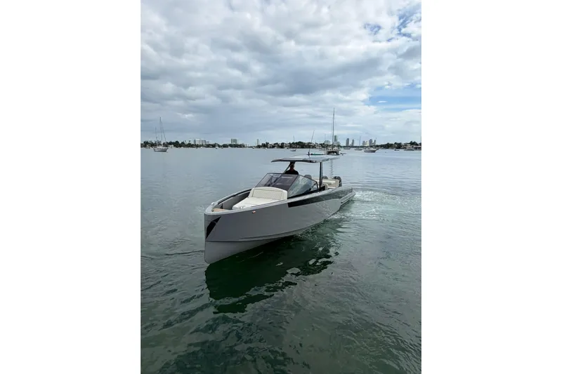 Virtue Yacht Photos Pics 2026 Virtue V10 luxury yacht cruising on a calm, scenic waterway.