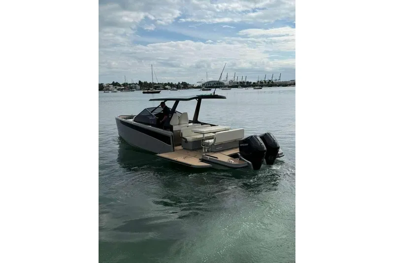 Virtue Yacht Photos Pics 2026 Virtue V10 boat on water, featuring dual outboard motors and sleek design.