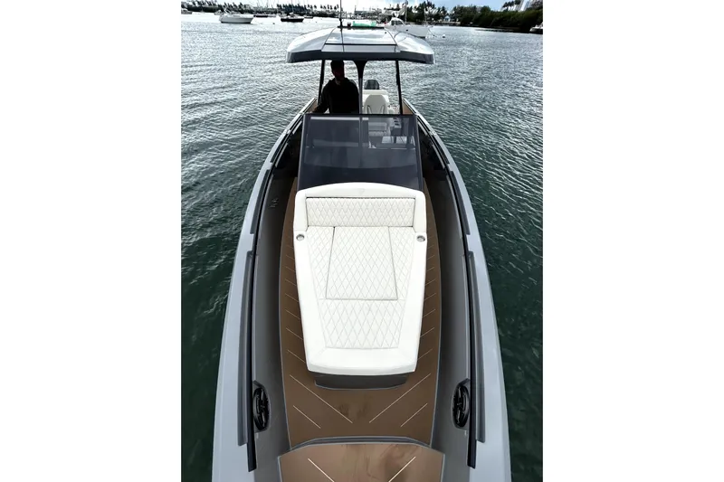 Virtue Yacht Photos Pics 2026 Virtue V10 luxury yacht with sleek design and spacious deck on calm waters.