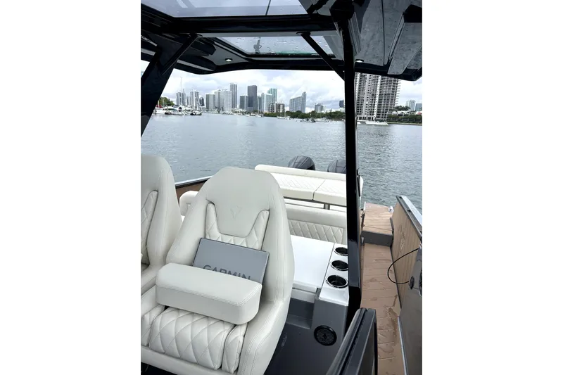 Virtue Yacht Photos Pics Luxury interior of 2026 Virtue V10 boat with city skyline view.