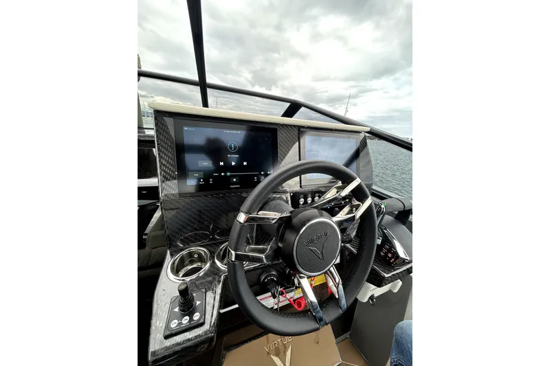 Virtue Yacht Photos Pics Steering wheel and dashboard of 2026 Virtue V10 boat with digital displays.