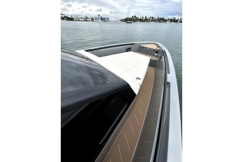 Virtue Yacht Photos Pics 2026 Virtue V10 boat on calm water, showcasing sleek design and luxurious deck.