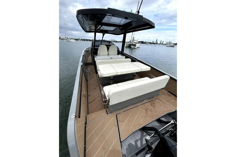 Virtue Yacht Photos Pics Luxury 2026 Virtue V10 boat with sleek design and comfortable seating on calm waters.