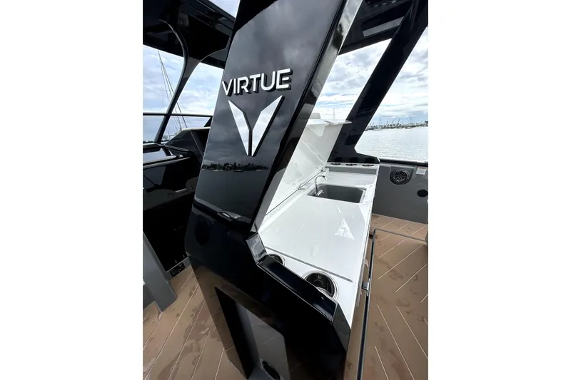 Virtue Yacht Photos Pics 2026 Virtue V10 yacht interior with sleek black and white design, featuring a sink.