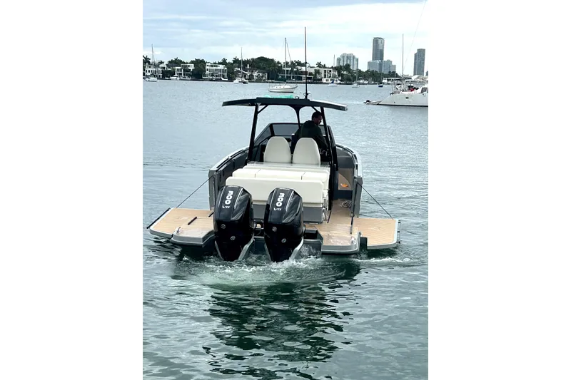 Virtue Yacht Photos Pics Virtue V10 2026 boat with dual engines cruising on a calm waterway.