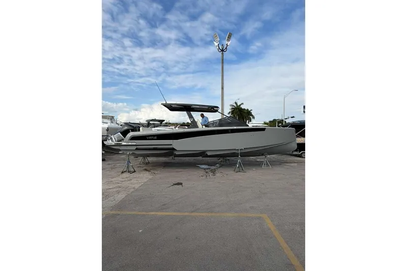 Virtue Yacht Photos Pics 2026 Virtue V10 boat on display under a clear blue sky.