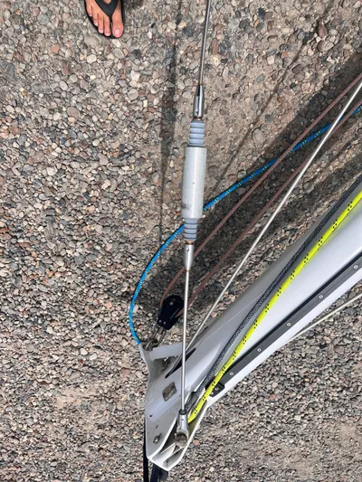 Sv Mototi Yacht Photos Pics Close-up of a 1991 Nautor Swan 46 sailboat rigging on a gravel surface.