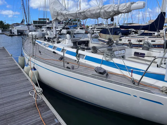 Sv Mototi Yacht Photos Pics Sailing yacht Nautor Swan 46, 1991 model, docked at marina with clear blue sky.