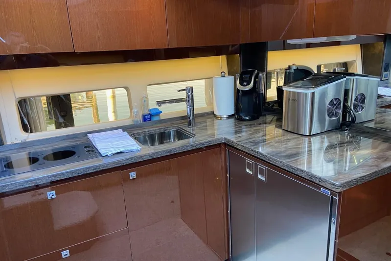 Godsend Yacht Photos Pics Luxurious kitchen interior of 2015 Sea Ray 470 Sundancer yacht with modern appliances.