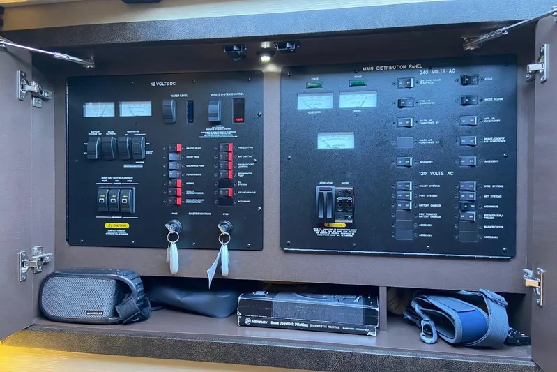 Godsend Yacht Photos Pics Electrical control panel of a 2015 Sea Ray 470 Sundancer yacht, featuring switches and gauges.