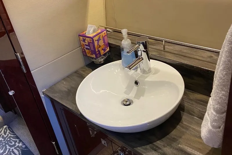 Godsend Yacht Photos Pics Luxurious bathroom sink on 2015 Sea Ray 470 Sundancer yacht with modern fixtures.