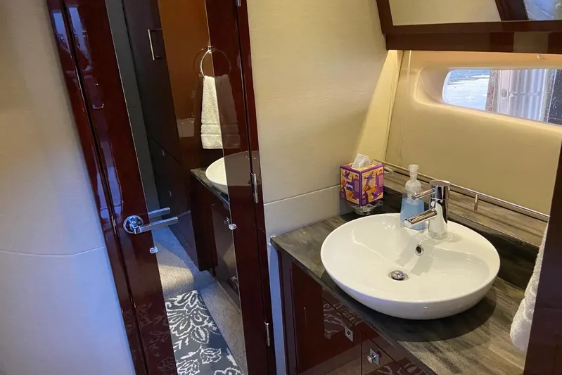 Godsend Yacht Photos Pics Luxurious bathroom interior of 2015 Sea Ray 470 Sundancer yacht with modern sink and fixtures.