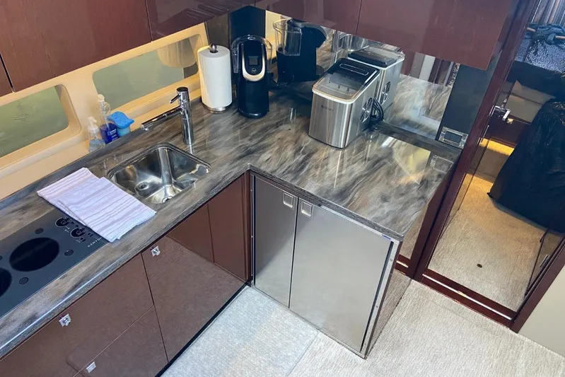 Godsend Yacht Photos Pics Luxurious kitchen area in 2015 Sea Ray 470 Sundancer yacht with modern appliances.