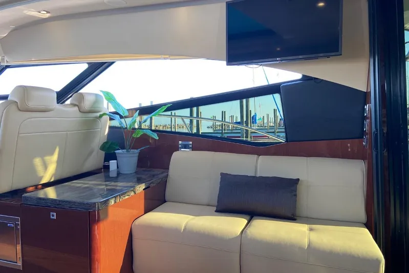 Godsend Yacht Photos Pics Luxurious interior of 2015 Sea Ray 470 Sundancer yacht with plush seating and modern decor.