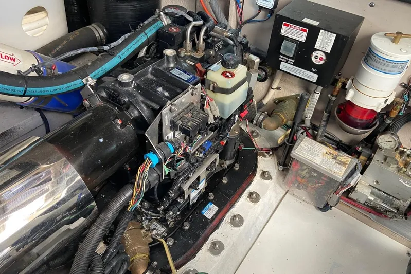 Godsend Yacht Photos Pics Engine room of a 2015 Sea Ray 470 Sundancer with visible wiring and components.
