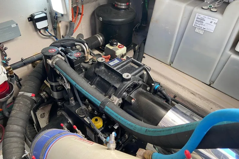 Godsend Yacht Photos Pics Engine compartment of 2015 Sea Ray 470 Sundancer, showcasing mechanical components and wiring.