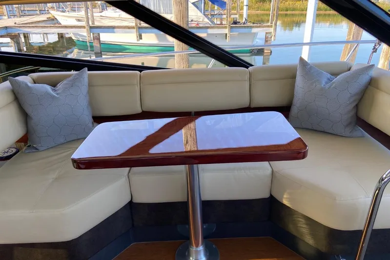 Godsend Yacht Photos Pics Luxurious 2015 Sea Ray 470 Sundancer interior with elegant seating and polished table.