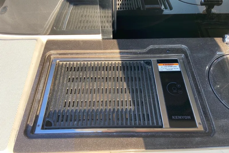 Godsend Yacht Photos Pics Outdoor grill on 2015 Sea Ray 470 Sundancer yacht, featuring Kenyon cooking surface.