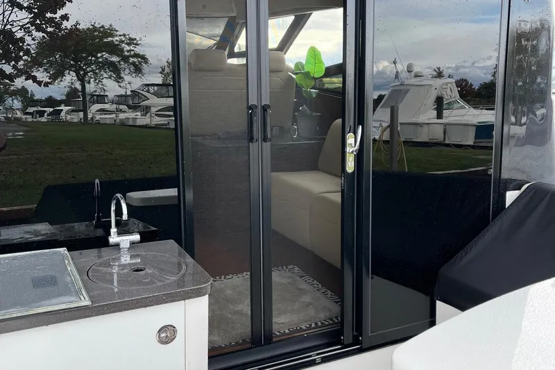 Godsend Yacht Photos Pics 2015 Sea Ray 470 Sundancer yacht with outdoor sink and sliding glass doors.
