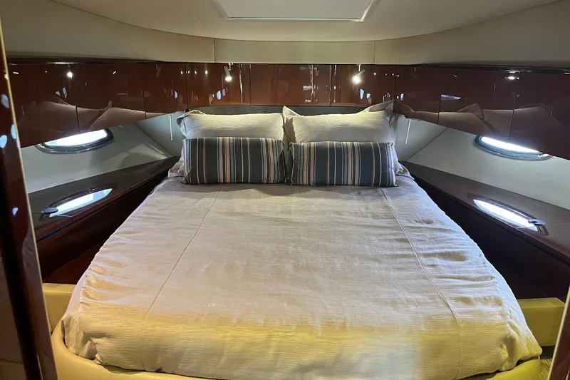 Godsend Yacht Photos Pics Luxurious bedroom interior of 2015 Sea Ray 470 Sundancer yacht with elegant bedding.