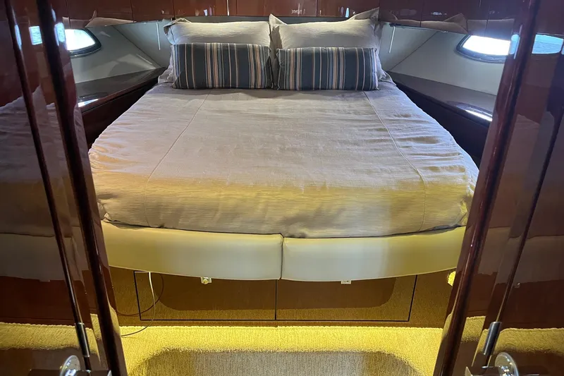 Godsend Yacht Photos Pics Luxurious bedroom interior of 2015 Sea Ray 470 Sundancer yacht with elegant bedding.