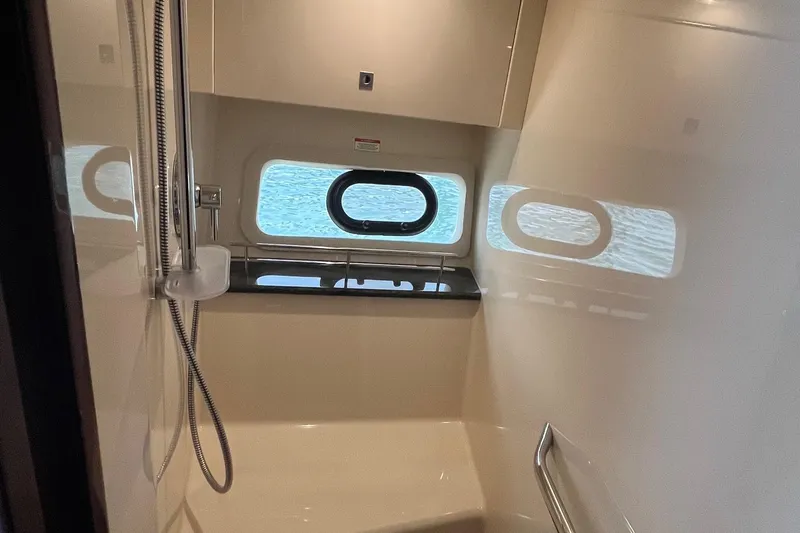 Godsend Yacht Photos Pics Interior of 2015 Sea Ray 470 Sundancer yacht bathroom with window and shower.