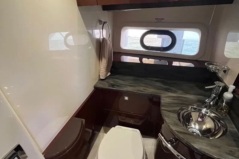 Godsend Yacht Photos Pics Luxurious bathroom interior of 2015 Sea Ray 470 Sundancer yacht with modern fixtures.