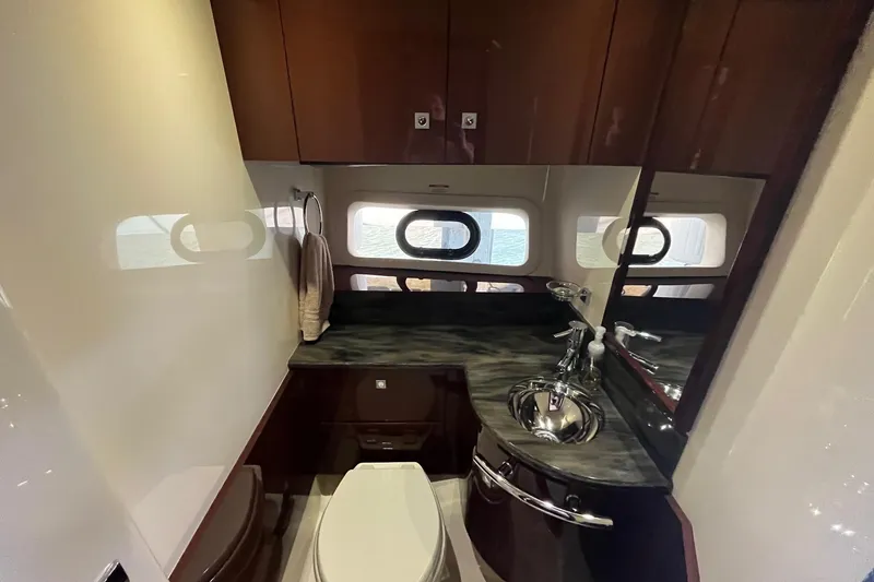 Godsend Yacht Photos Pics Luxurious bathroom interior of 2015 Sea Ray 470 Sundancer yacht with modern fixtures.
