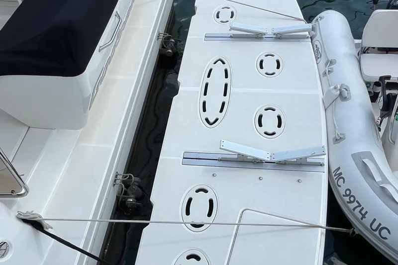 Godsend Yacht Photos Pics 2015 Sea Ray 470 Sundancer swim platform with attached inflatable boat.