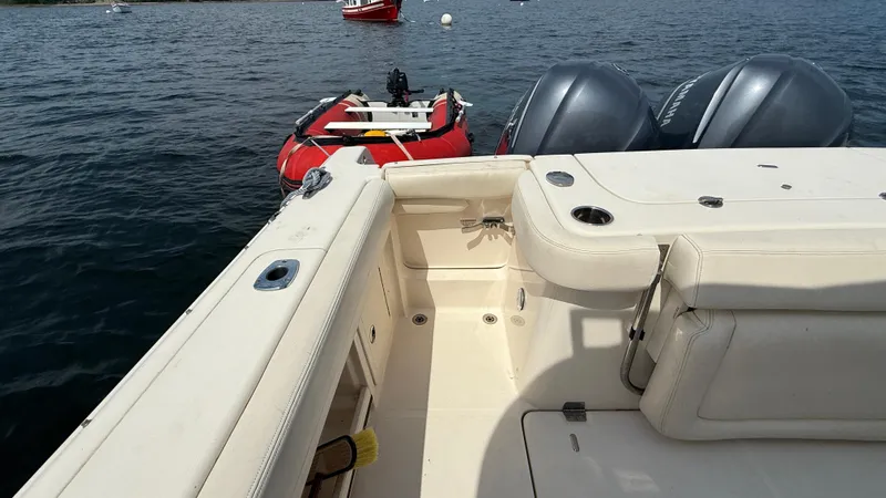 Aletha P Llc Yacht Photos Pics 2016 Grady-White Freedom 307 boat interior with dual engines and a red inflatable raft.