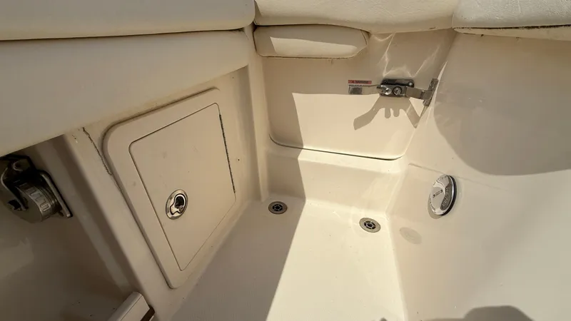 Aletha P Llc Yacht Photos Pics 2016 Grady-White Freedom 307 boat interior, featuring storage compartment and seating area.