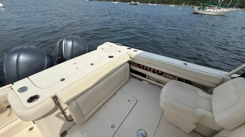 Aletha P Llc Yacht Photos Pics 2016 Grady-White Freedom 307 boat interior with dual outboard motors on a calm lake.