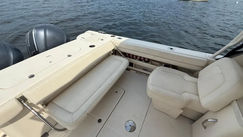 Aletha P Llc Yacht Photos Pics 2016 Grady-White Freedom 307 boat interior with seating, on calm water.