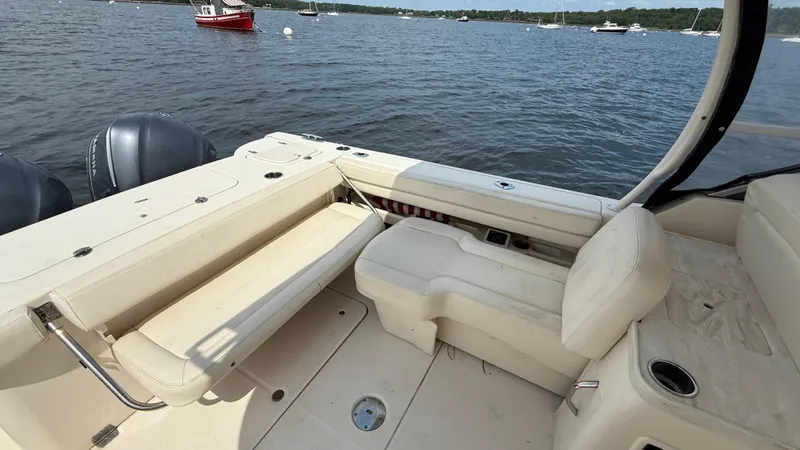 Aletha P Llc Yacht Photos Pics 2016 Grady-White Freedom 307 boat interior with seating, on a calm lake.