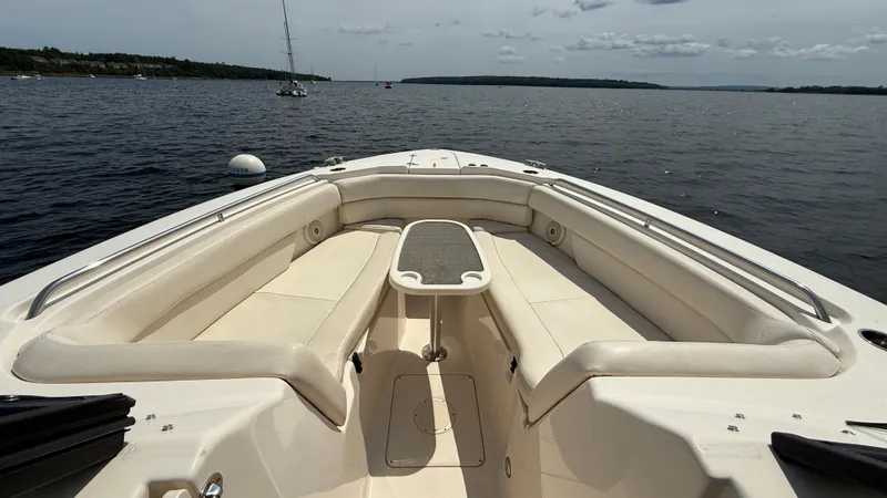 Aletha P Llc Yacht Photos Pics 2016 Grady-White Freedom 307 boat interior with spacious seating on calm water.