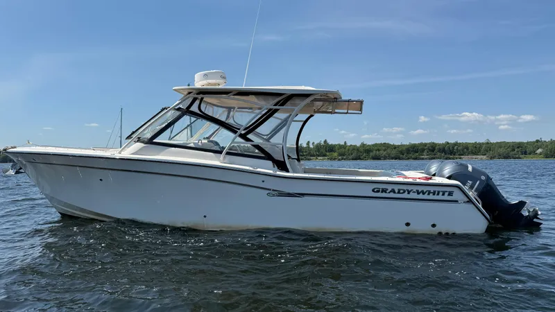 Aletha P Llc Yacht Photos Pics 2016 Grady-White Freedom 307 boat on water, clear sky background.