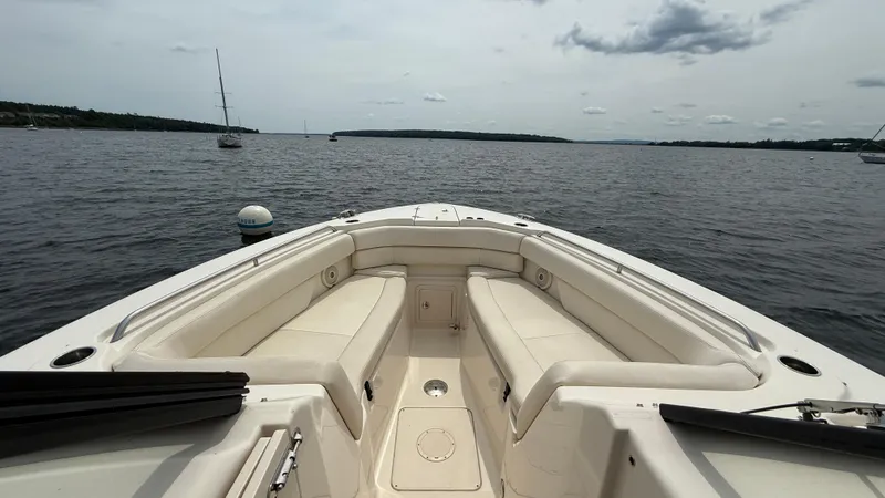 Aletha P Llc Yacht Photos Pics 2016 Grady-White Freedom 307 boat interior with spacious seating on calm water.