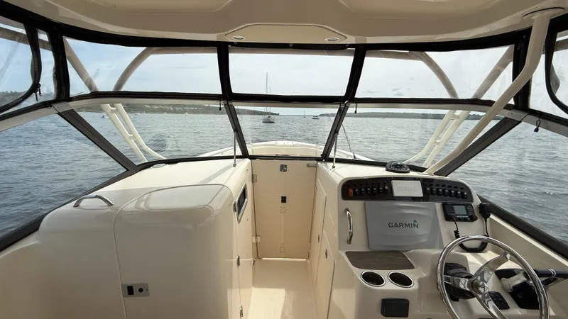 Aletha P Llc Yacht Photos Pics 2016 Grady-White Freedom 307 boat interior with Garmin navigation system on open water.