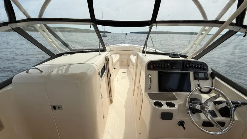 Aletha P Llc Yacht Photos Pics 2016 Grady-White Freedom 307 boat interior with steering wheel and control panel.