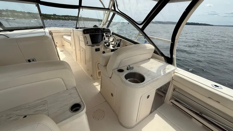 Aletha P Llc Yacht Photos Pics 2016 Grady-White Freedom 307 boat interior with helm, seating, and water view.