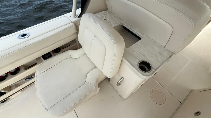 Aletha P Llc Yacht Photos Pics 2016 Grady-White Freedom 307 boat interior with white seating and cup holder.