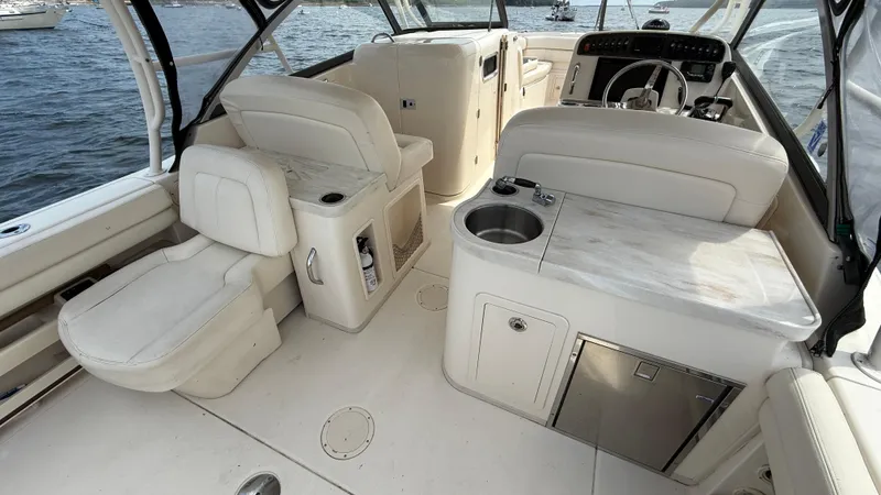 Aletha P Llc Yacht Photos Pics 2016 Grady-White Freedom 307 boat interior with seating and helm, on the water.