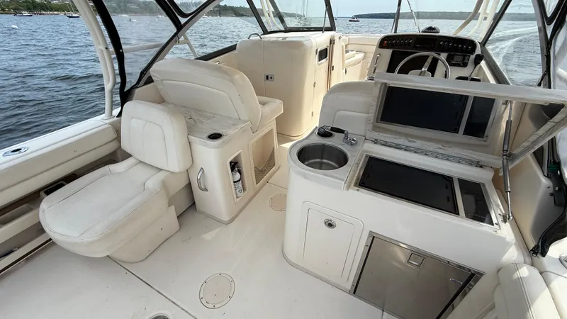 Aletha P Llc Yacht Photos Pics 2016 Grady-White Freedom 307 boat interior with seating and helm, on a lake.
