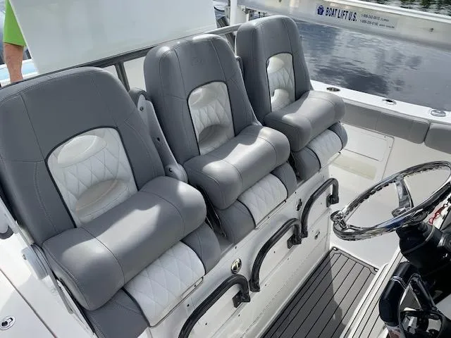  Yacht Photos Pics 2017 Sea Fox 328 Commander boat seats with gray and white upholstery.
