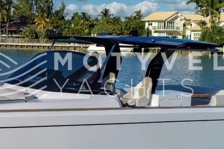  Yacht Photos Pics 2023 Pardo Yachts 50 docked near waterfront homes, showcasing sleek design and luxury features.