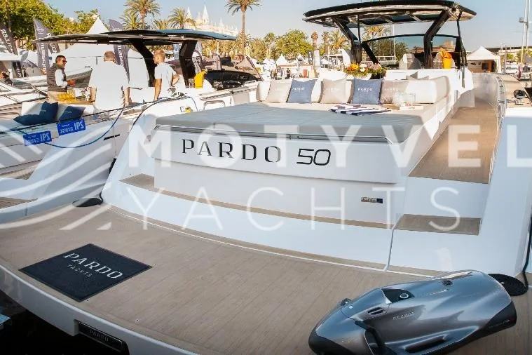  Yacht Photos Pics 2023 Pardo Yachts 50 luxury yacht at a boat show, featuring sleek design and spacious deck.