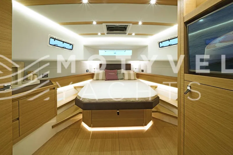  Yacht Photos Pics Luxurious interior of 2023 Pardo Yachts 50, featuring modern wood finishes and ambient lighting.